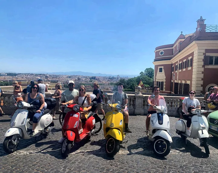 A group on Vespas at the Janiculum viewpoint over Rome