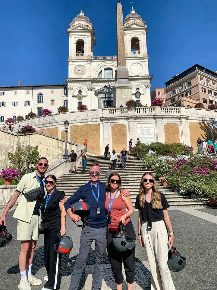 A group with their helmets at the Spanish Steps
